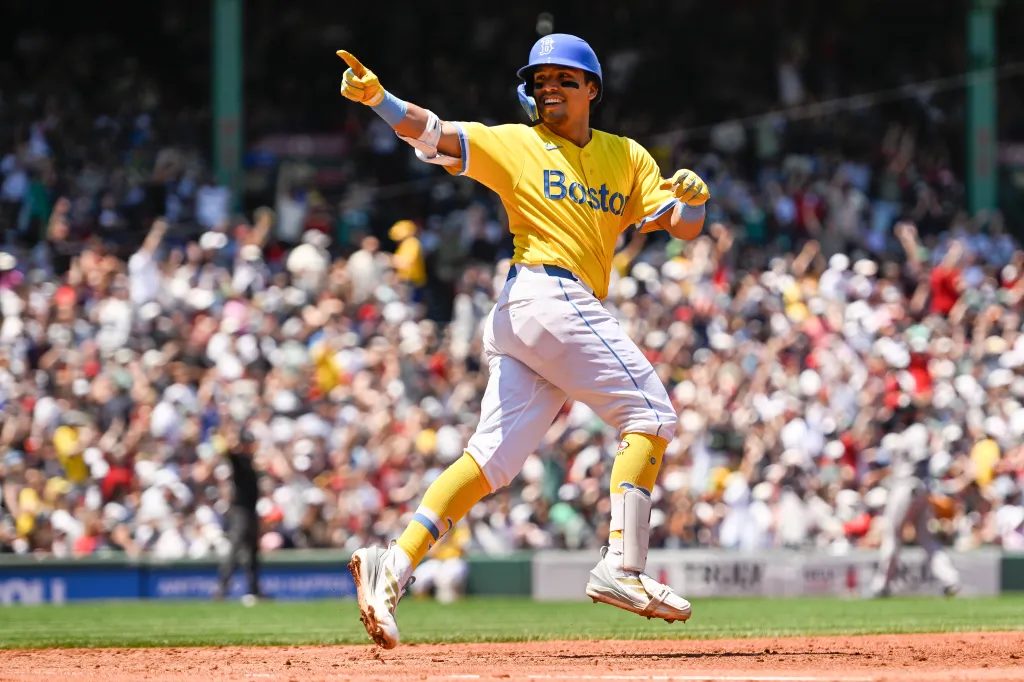 Anthony Seigler #48 of the Boston Red Sox reacts after hitting a solo home run.