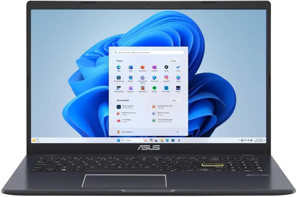 Black ASUS laptop with the Windows 11 desktop and start menu open.