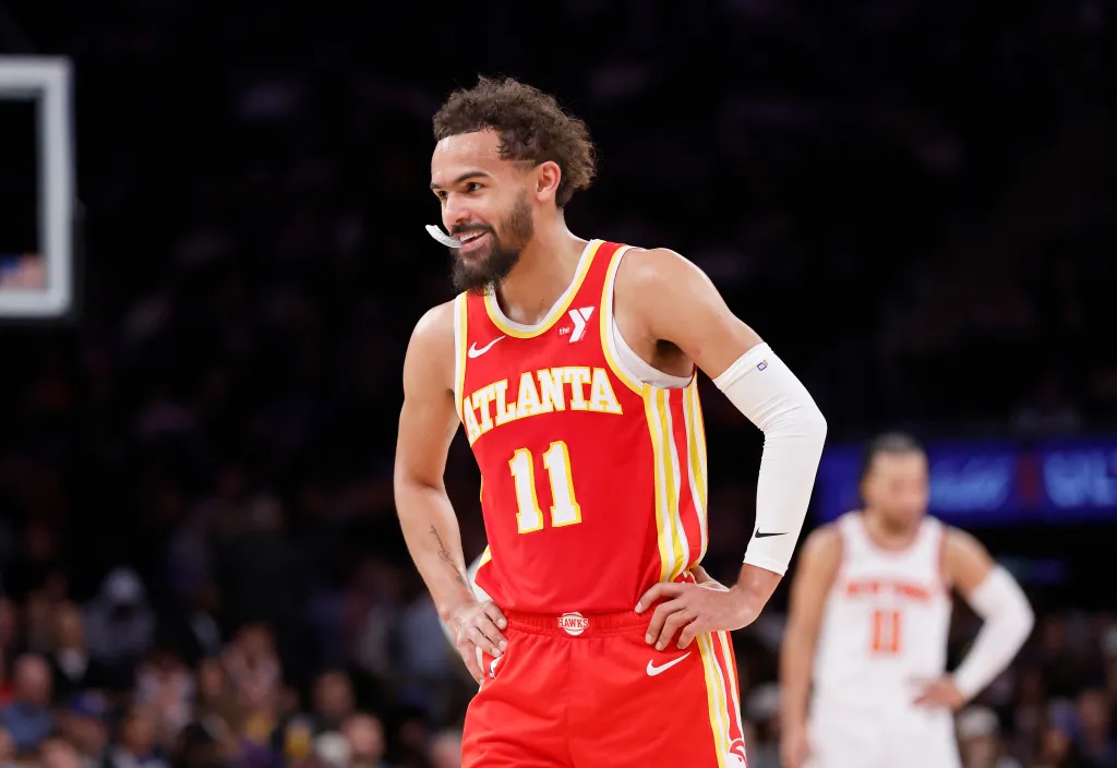 Atlanta Hawks guard Trae Young reacting on the court.