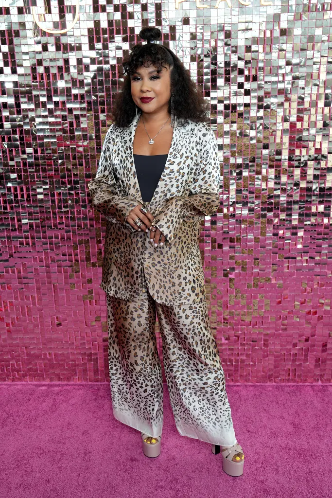 Angela Yee in a leopard print suit at Juvia's Place presents The Reign of Blushed & Bronzed Radiance.