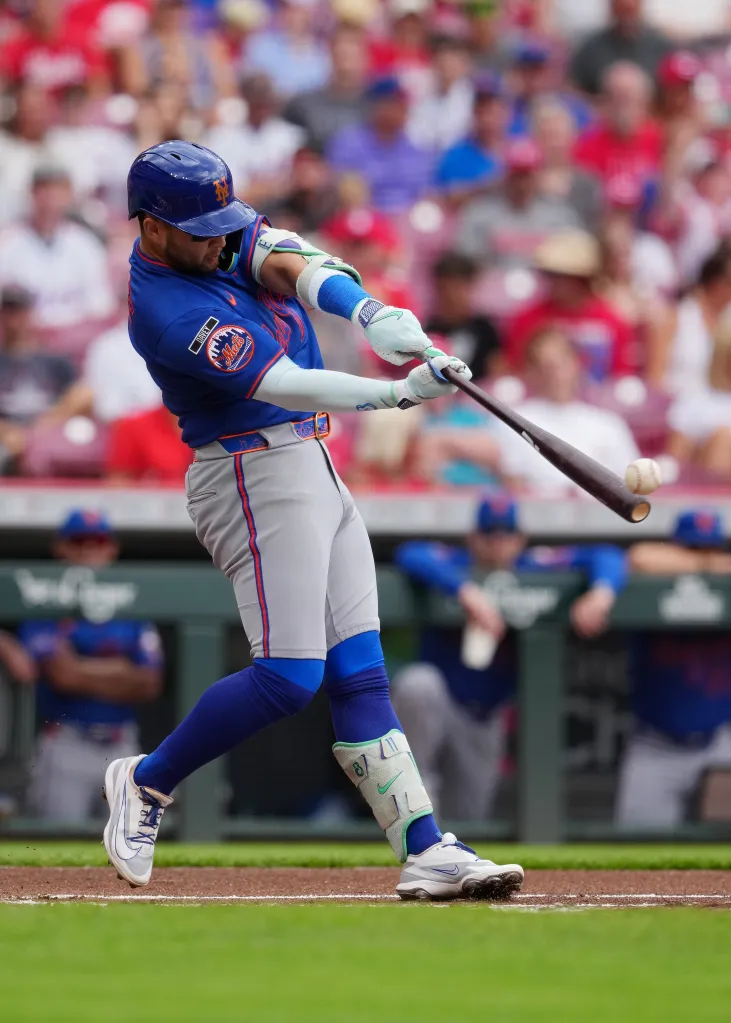 The Mets' Bo Bichette hits a single against the Reds in the first inning on June 17, 2026.