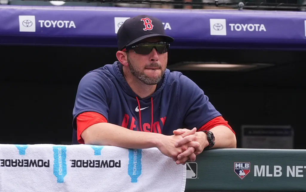Boston Red Sox interim manager Chad Tracy looks on from the dugout.