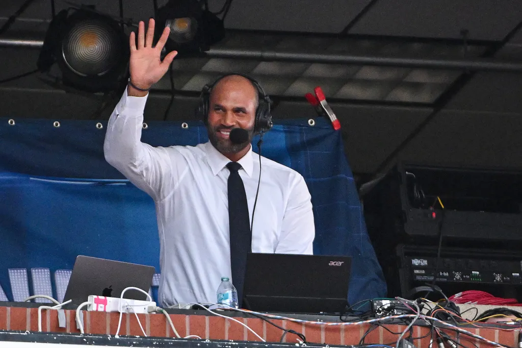 Broadcaster Albert Pujols waving to fans.
