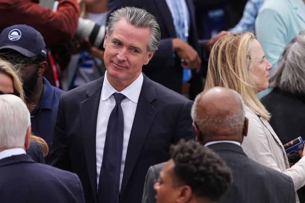 California Governor Gavin Newsom mingling at the Obama Presidential Center dedication.