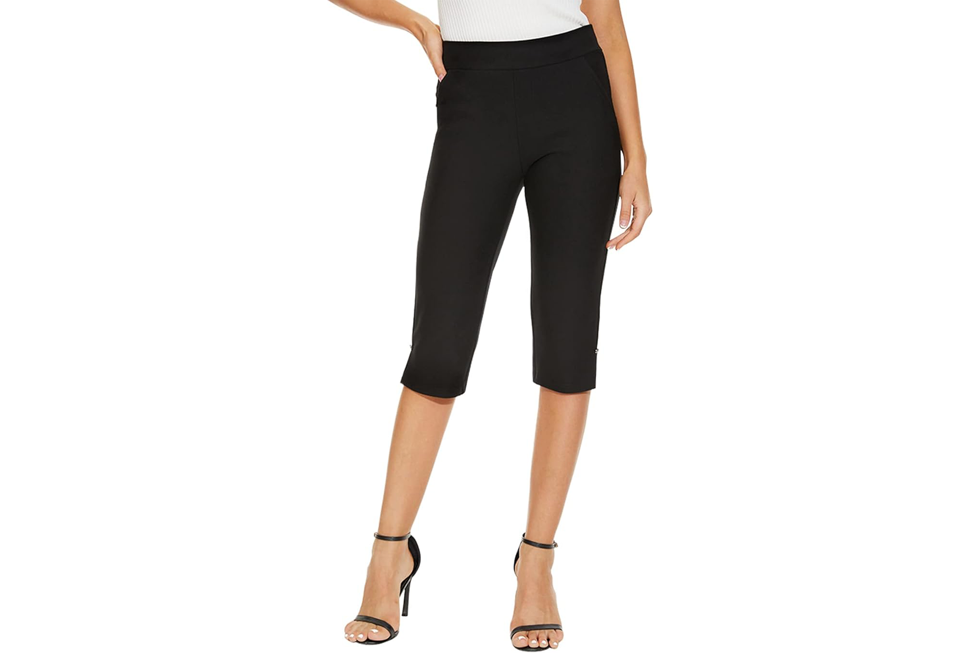 Black capri pants on a person wearing high heels.