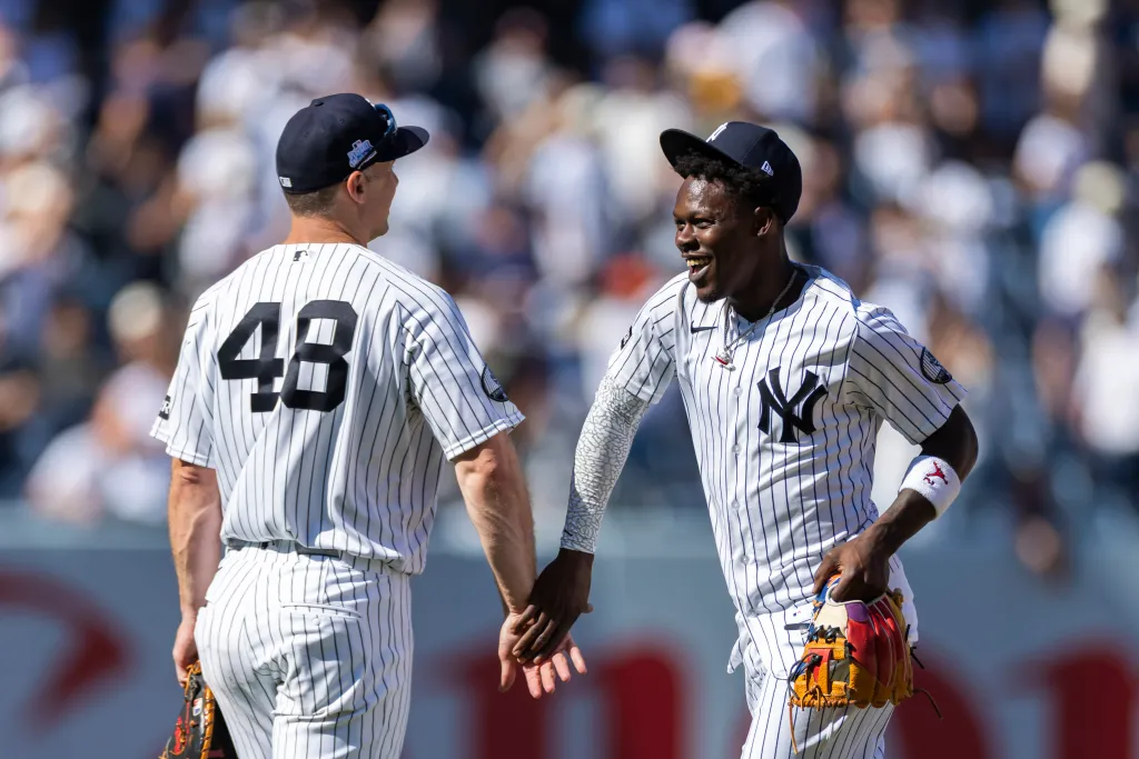New York Yankees first baseman Paul Goldschmidt (48) celebrates with second baseman Jazz Chisholm Jr. (13).