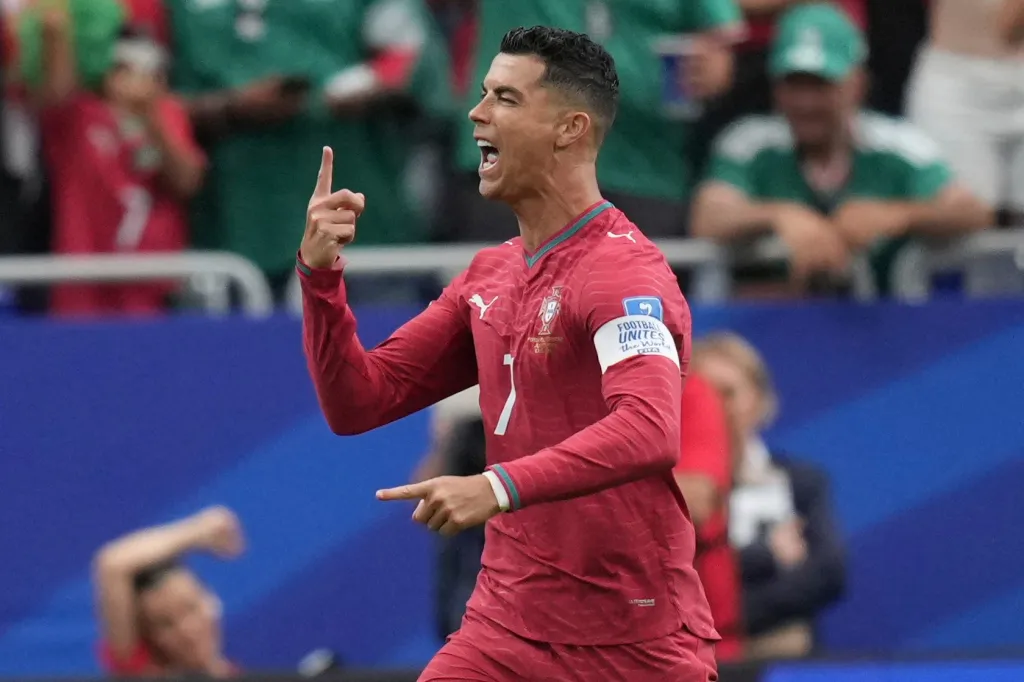 Cristiano Ronaldo celebrating after scoring a goal for Portugal during a World Cup match.
