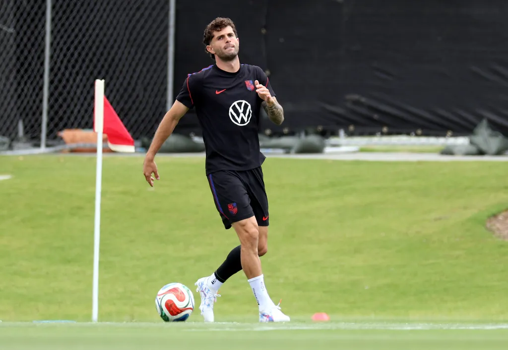 Christian Pulisic of the United States dribbling a soccer ball during a training session.