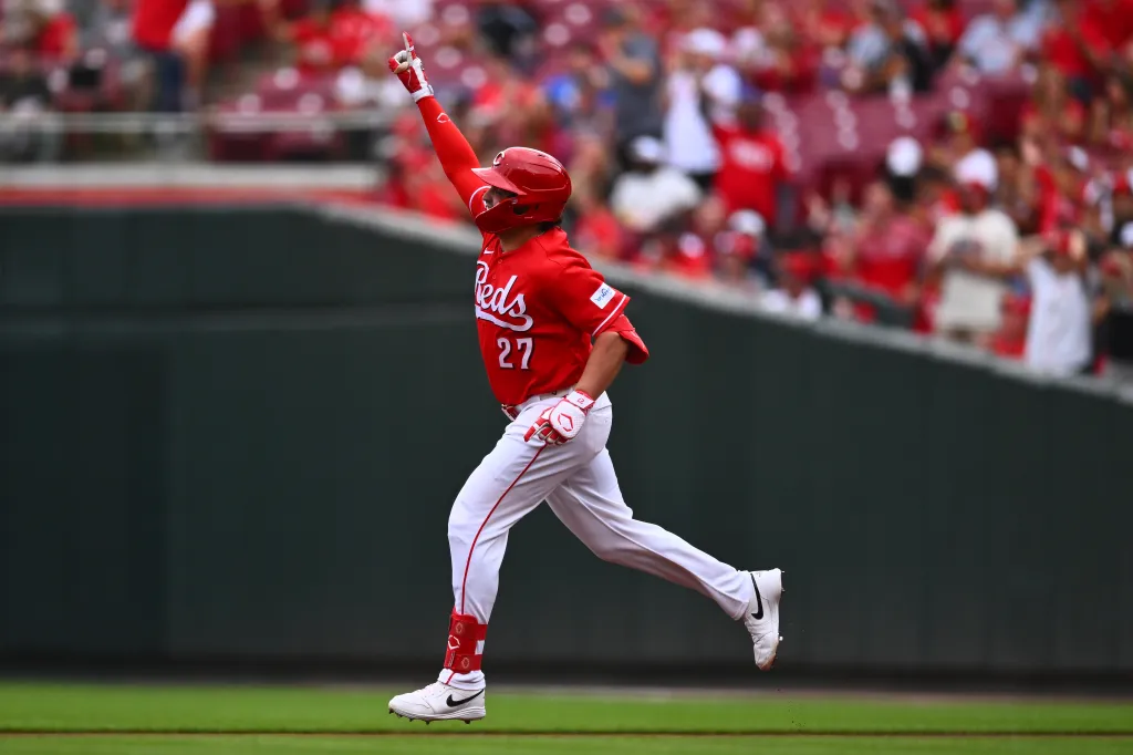 Cincinnati Reds player Sal Stewart rounding the bases after hitting a home run.