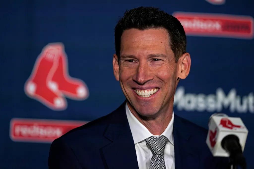 Craig Breslow, the Boston Red Sox chief baseball officer, smiles while being introduced at a press event.