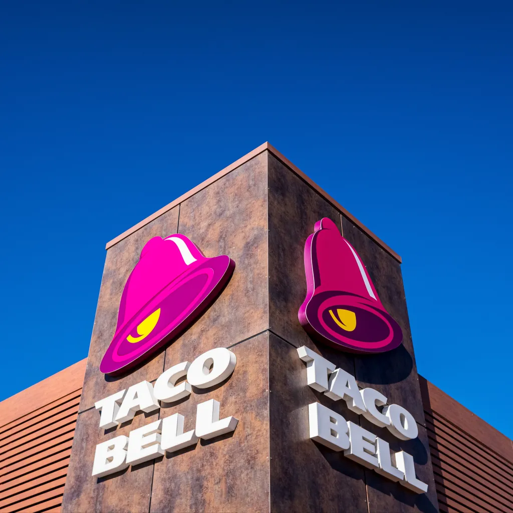 The exterior of a Taco Bell restaurant with the company's logo.
