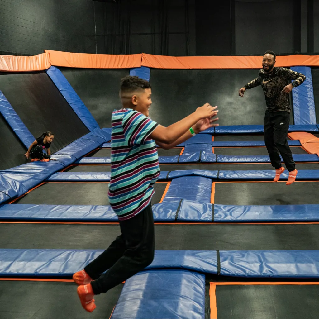 Derron Reed plays with his 10-year-old son Ezra and his 4-year-old daughter Kendall at Sky Zone Trampoline Park