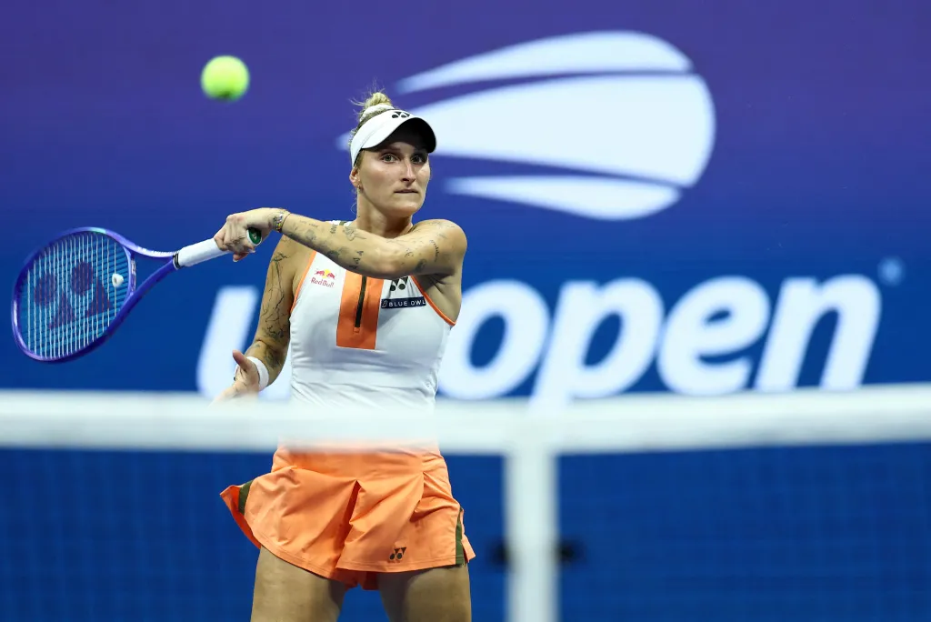 Czech Republic's Marketa Vondrousova plays a forehand return to Kazakhstan's Elena Rybakina during their women's singles round of 16 tennis match on day eight of the US Open tennis tournament at the USTA Billie Jean King National Tennis Center in New York City, on August 31, 2025.