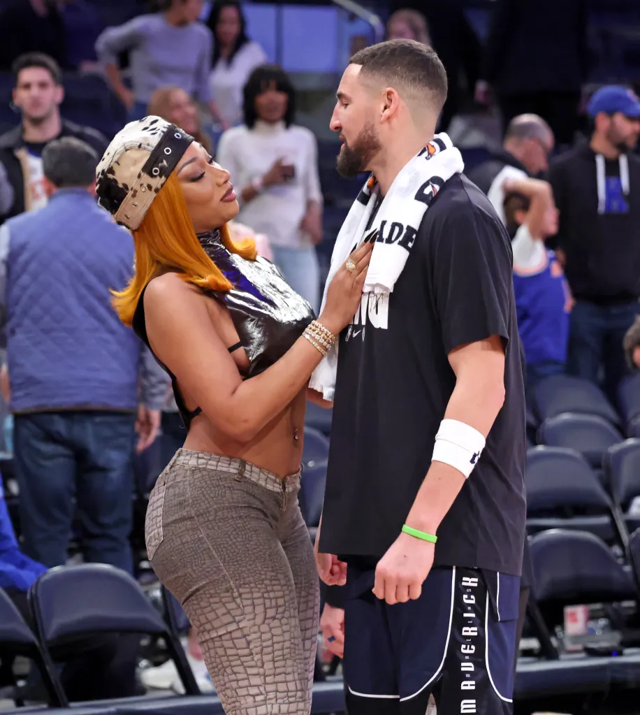 Music artist Megan Thee Stallion greets Dallas Mavericks guard Klay Thompson.