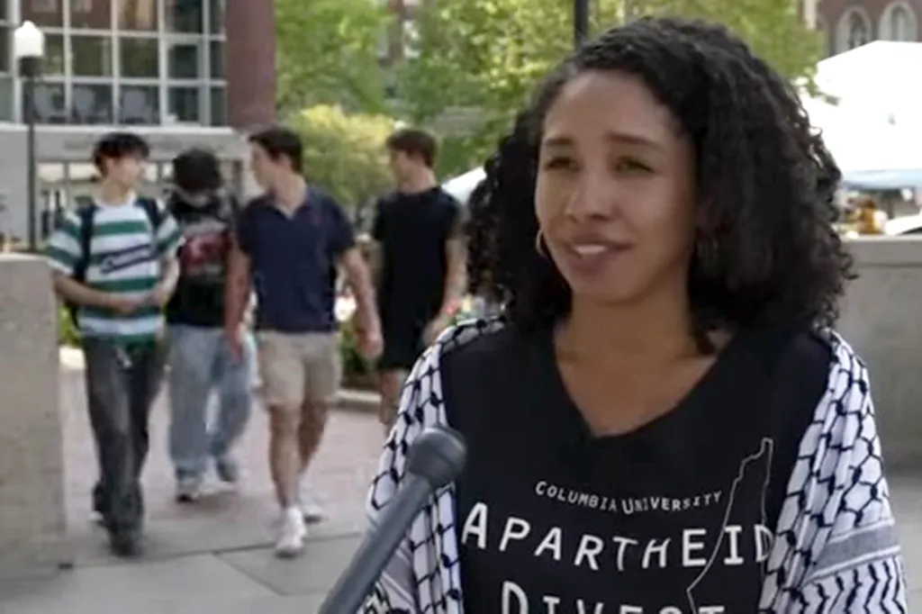 Darializa Avila Chevalier, Columbia University alum, is interviewed by the Associated Press at an on-campus Pro-Palestinian and Anti-Israel encampment.