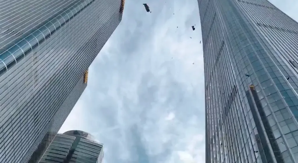 Debris falling from the top of the CITIC Tower in Beijing after a small plane crashed into it.