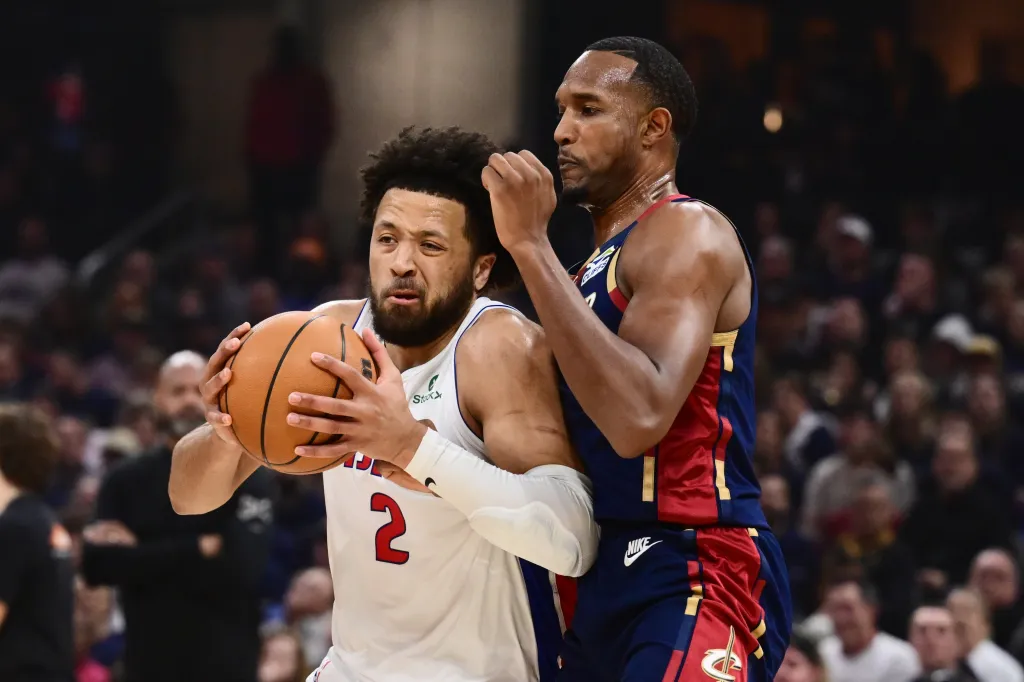 Detroit Pistons guard Cade Cunningham (2) drives to the basket against Cleveland Cavaliers center Evan Mobley (4) during an NBA Playoffs game.