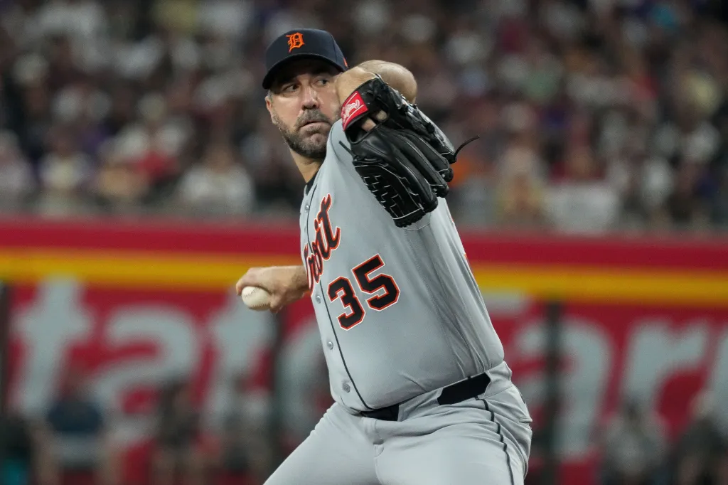 Detroit Tigers pitcher Justin Verlander in a gray uniform throwing a pitch.