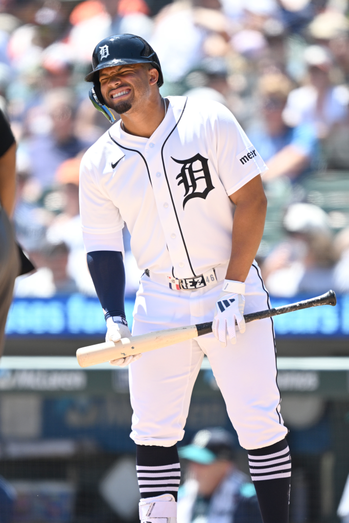 Wenceel Pérez reacts to hitting a foul tip into his groin during a baseball game.