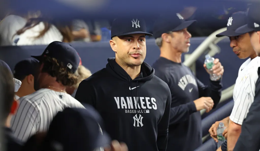 Giancarlo Stanton of the New York Yankees in the dugout.