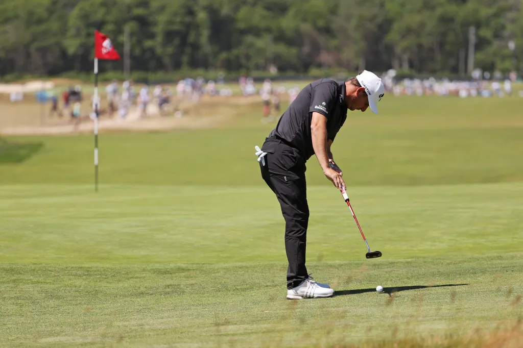 Emiliano Grillo lining up a putt on the 16th green during the U.S. Open golf tournament.