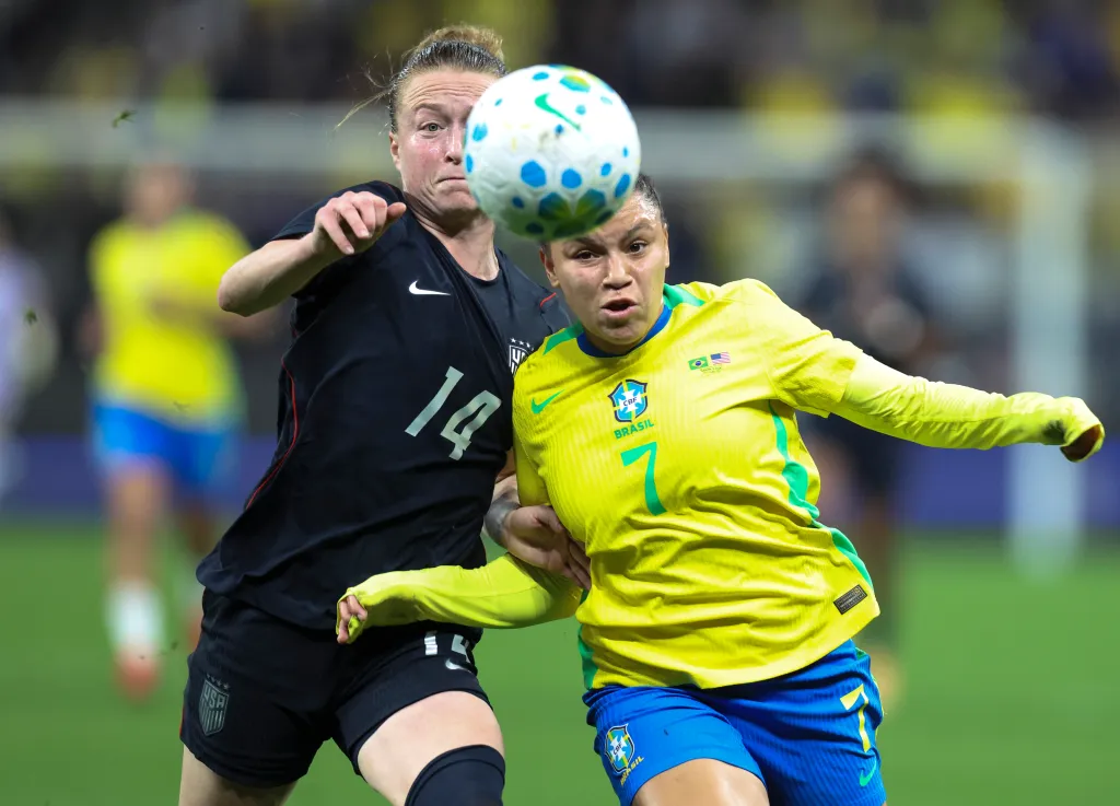 Emily Sonnett of United States and Dudinha of Brazil fight for the ball during an international friendly match between Brazil and United States at Neo Quimica Arena on June 06, 2026 in Sao Paulo, Brazil. 