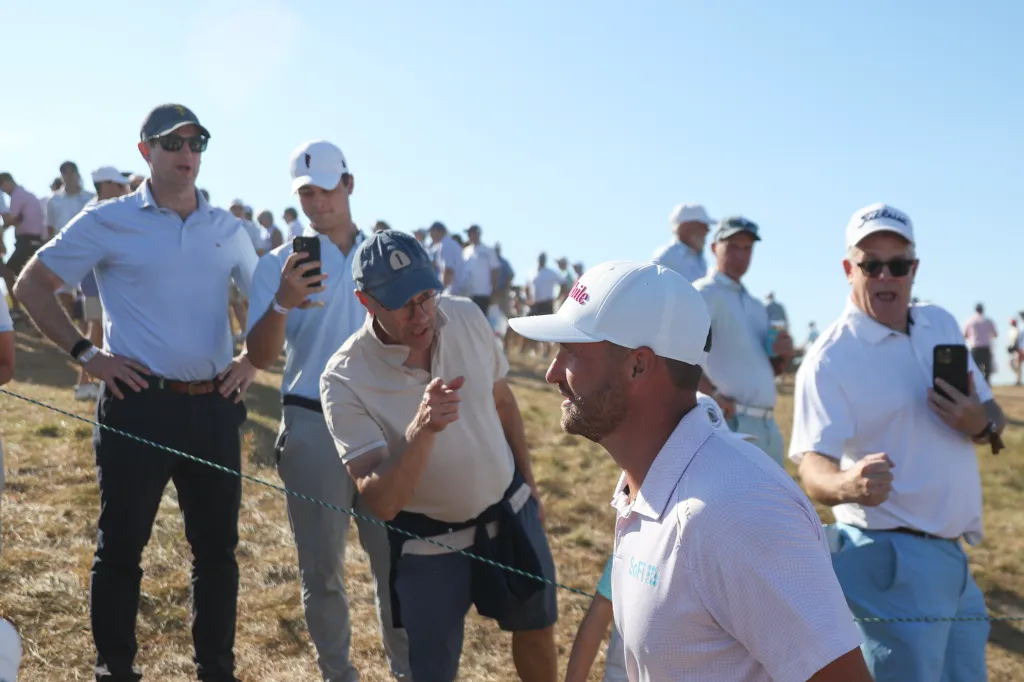 Wyndham Clark speaks with fans while walking between holes at the 126th U.S. Open Championship.