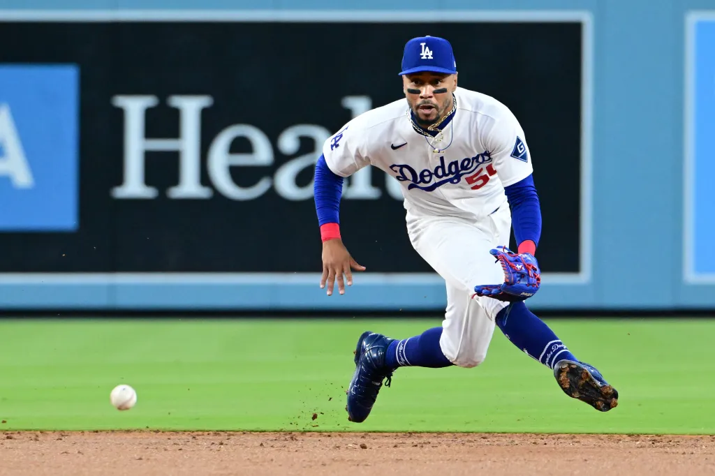 Los Angeles Dodgers shortstop Mookie Betts (50) fields the ball during a baseball game.