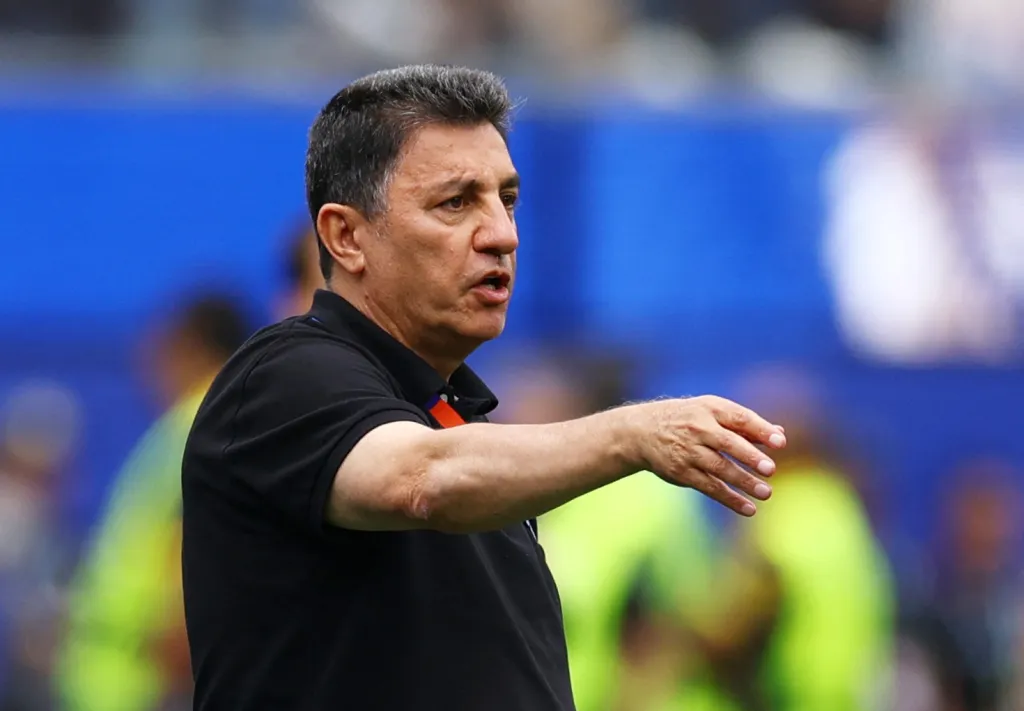 Iran coach Amir Ghalenoei reacts.