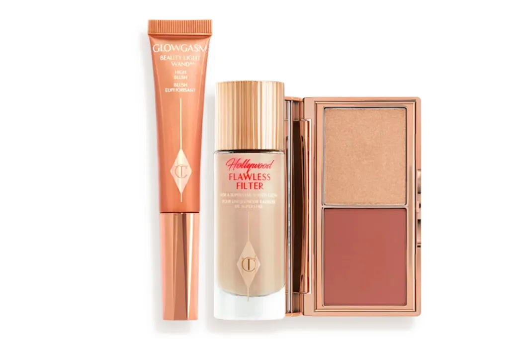 Charlotte Tilbury Flawless Filter foundation, Beauty Light Wand, and blush/highlight palette.
