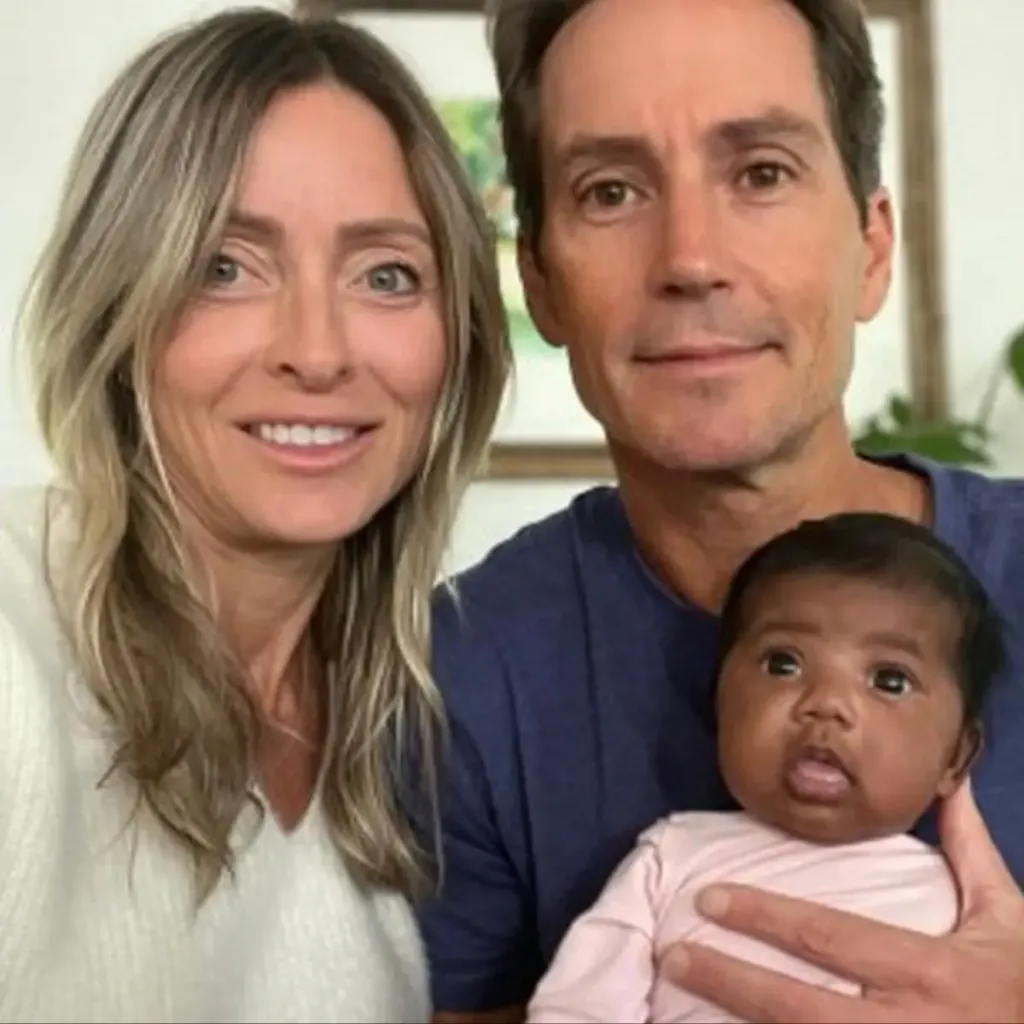 Tiffany Score and Steven Mills with their daughter Shea.