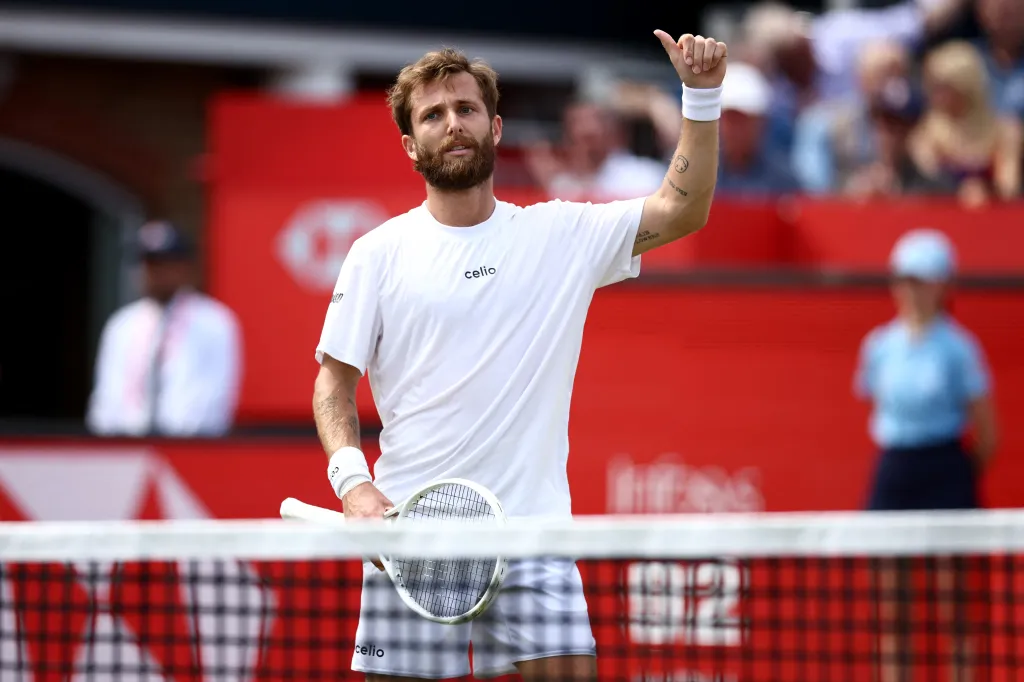 Corentin Moutet celebrates his victory at Queen's Club in west London.