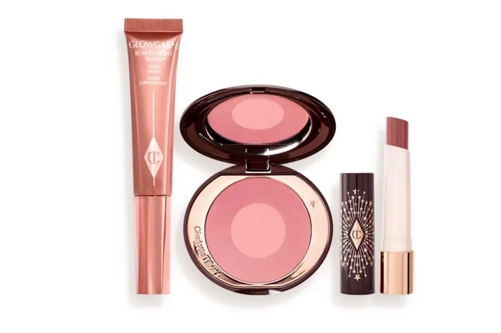 "Glowgasm" Charlotte Tilbury makeup set including a liquid highlighter, a blush compact, and a lipstick.