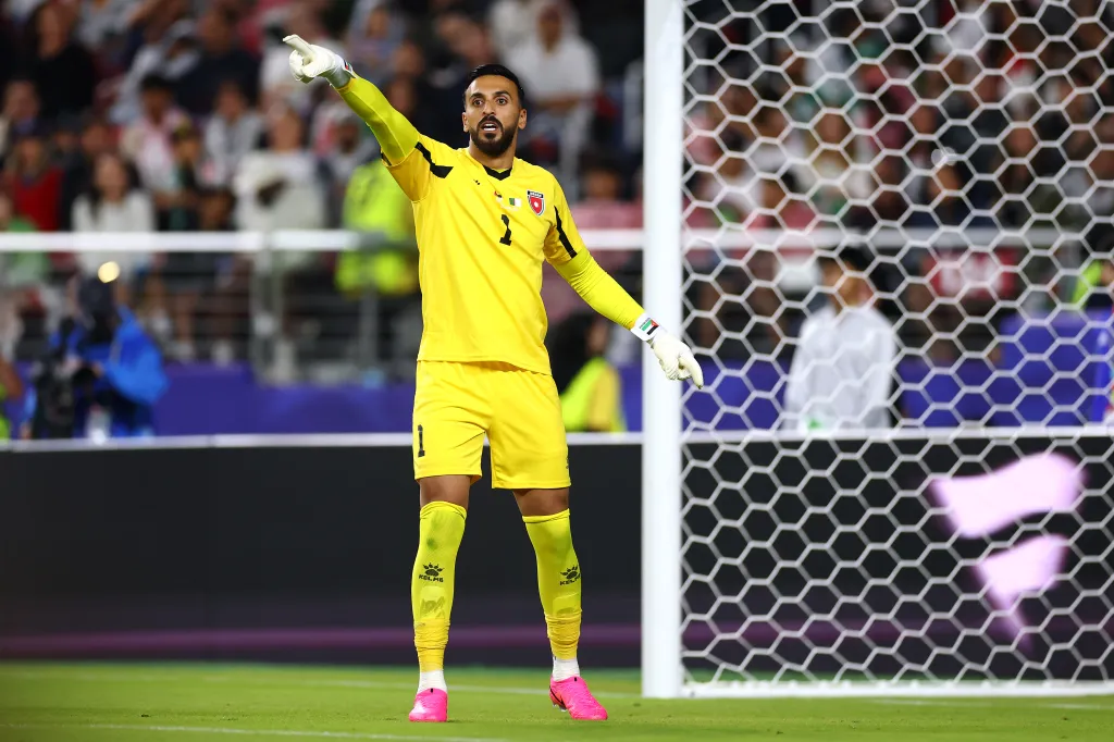 Jordan's goalkeeper, Yazeed Abulaila, in action during a FIFA World Cup 2026 match.