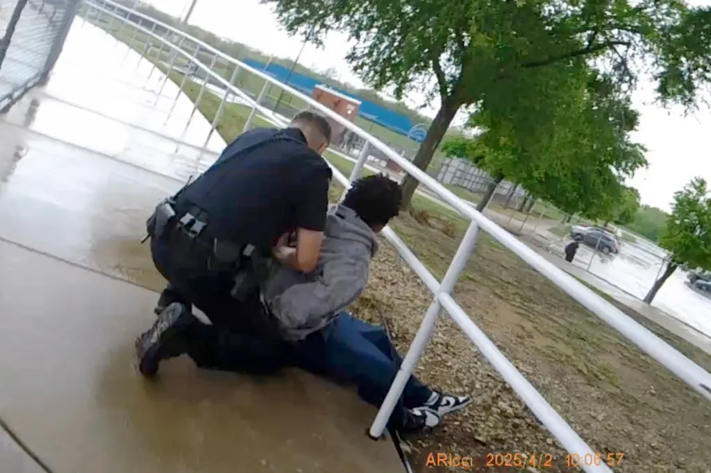 Police bodycam footage of an officer arresting a person by kneeling on them.