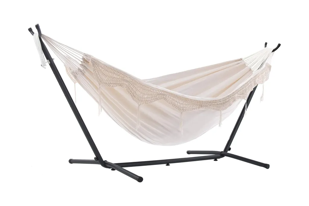 A white hammock with black metal legs