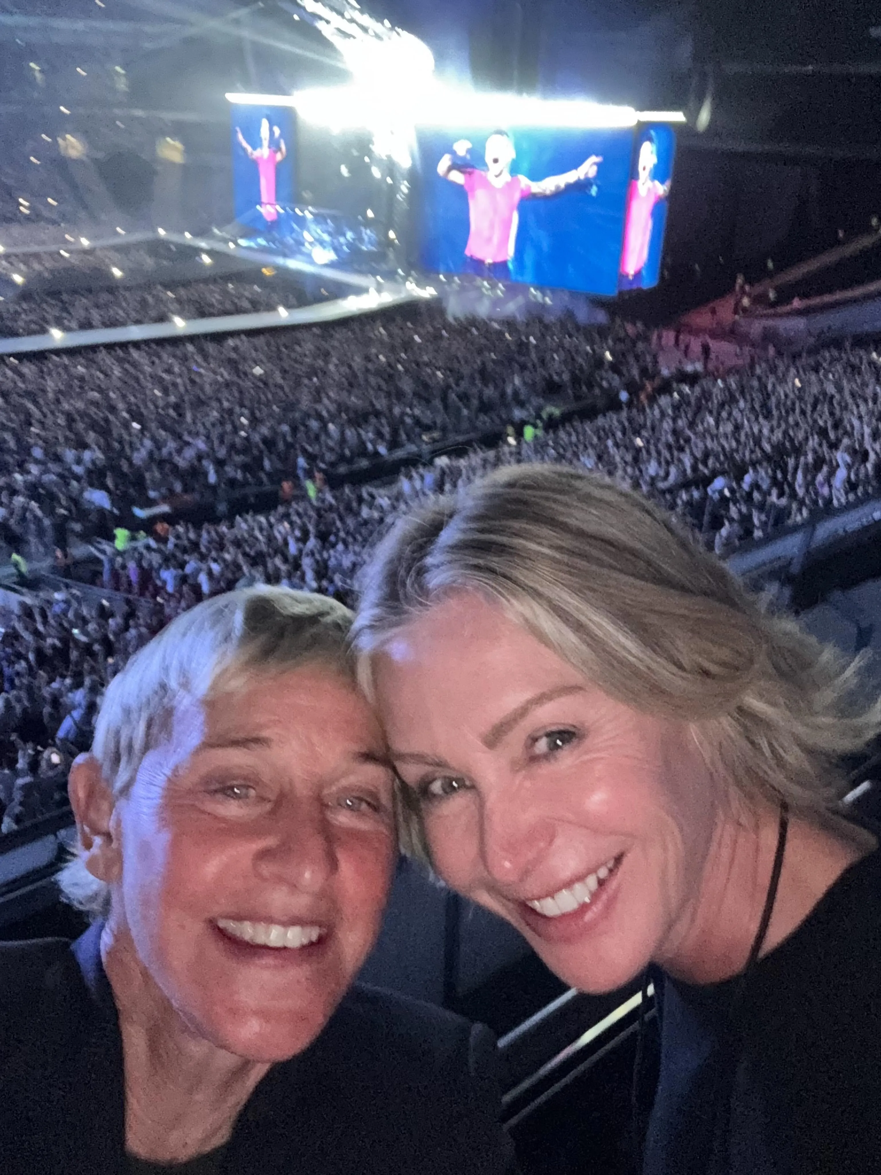 Ellen Degeneres and wife Portia Di Rossi jam out to Harry Styles at Wembley Stadium. 