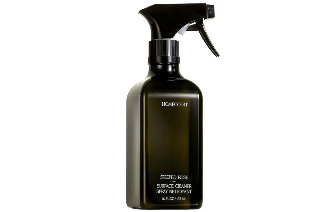 Homecourt Steeped Rose Surface Cleaner Spray, 16 fl oz / 473 ml, in a dark green bottle with a black spray nozzle.