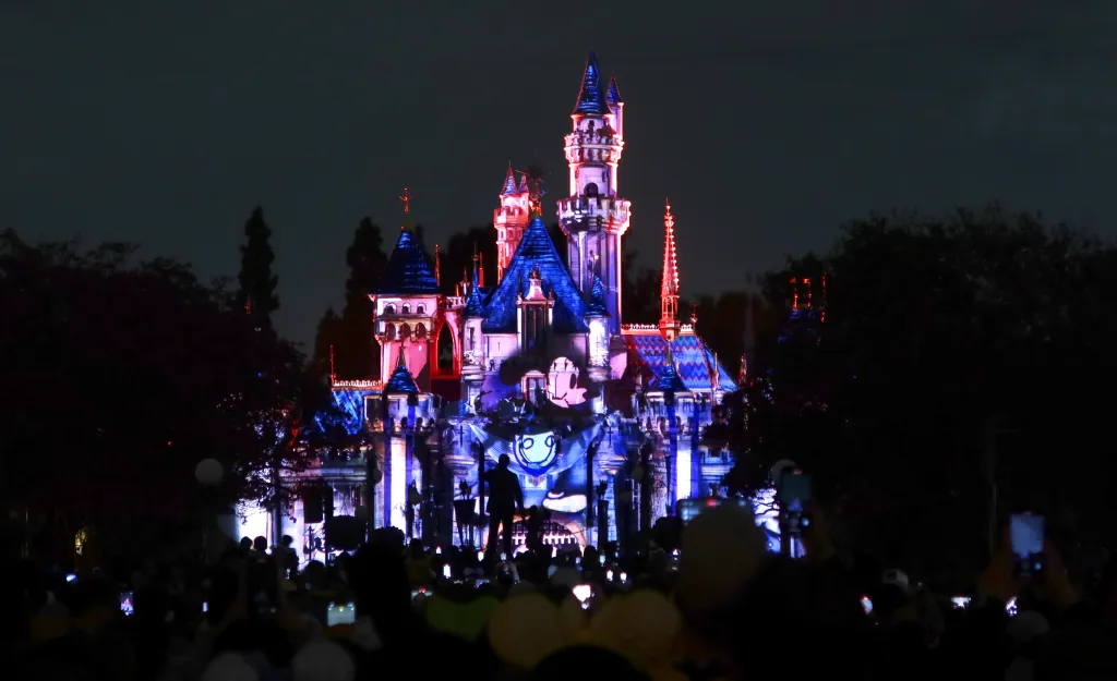 Mickey Mouse projected onto Sleeping Beauty Castle at Disneyland.