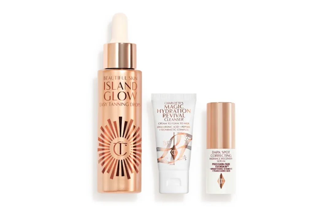 Three Charlotte Tilbury beauty products: Island Glow Easy Tanning Drops, Magic Hydration Revival Cleanser, and Dark Spot Correcting Radiance Recovery Serum.