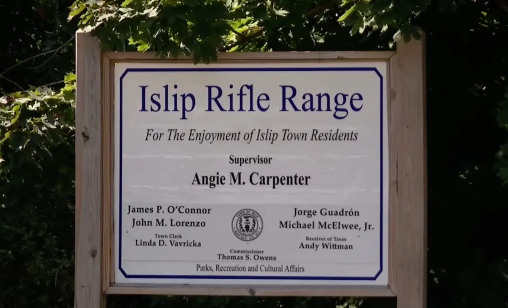 Sign for Islip Rifle Range, listing supervisors and other officials.