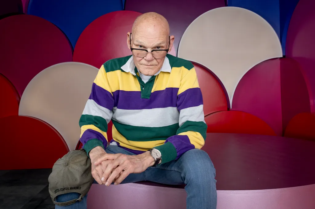 James Carville poses for a portrait wearing a striped polo shirt.