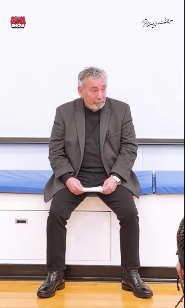 James Dolan sitting on a bench.
