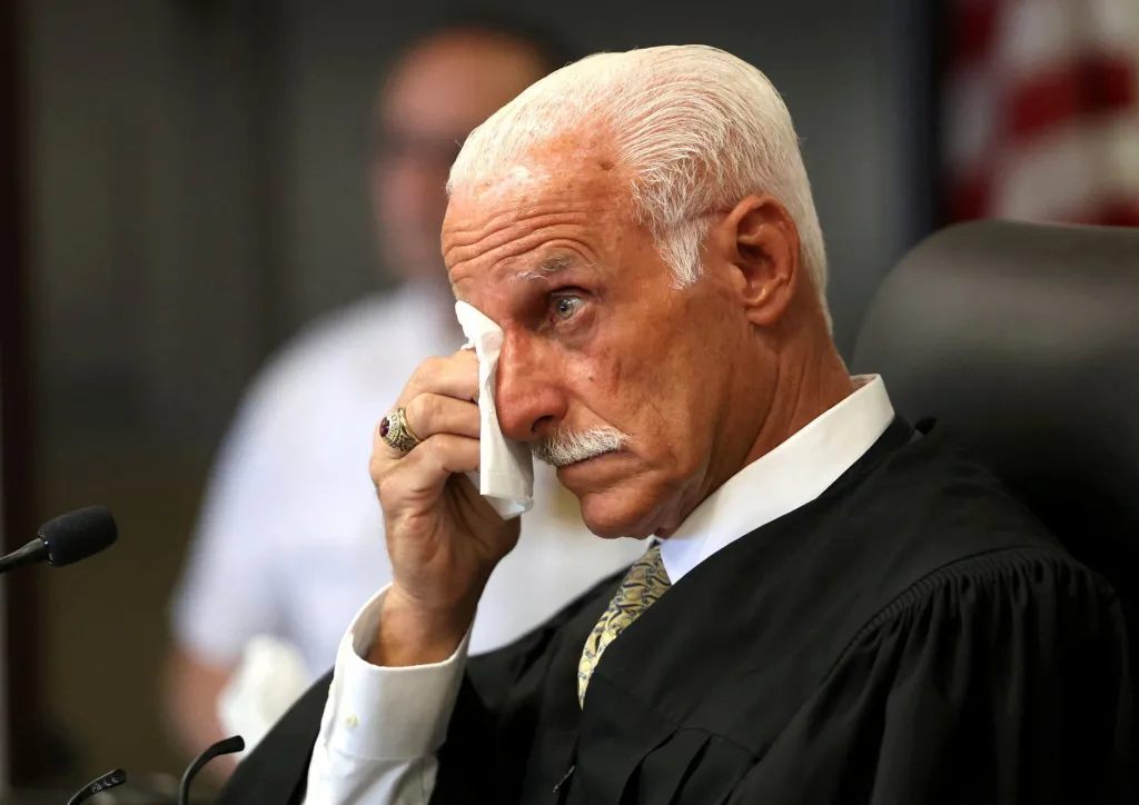 Judge Tim Mazzei wiping his eye with a tissue during the sentencing of Rex Heuermann.