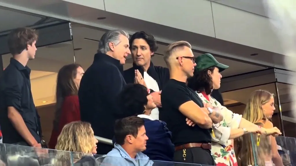 California Governor Gavin Newsom and Justin Trudeau talking at the World Cup.