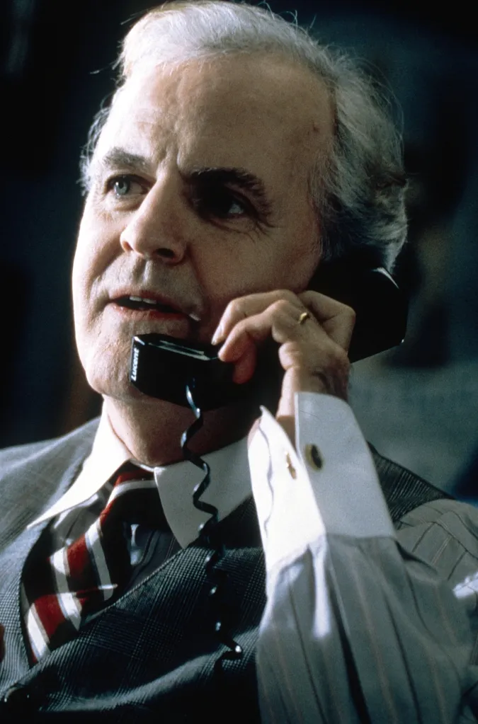 James Handy talking on a telephone in a close-up portrait from the 1999 movie K-911.
