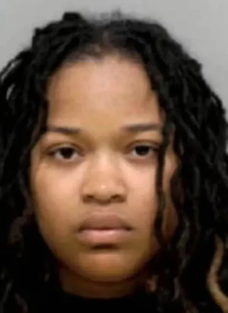 Mugshot of Kierianna Long with long dark dreadlocks.