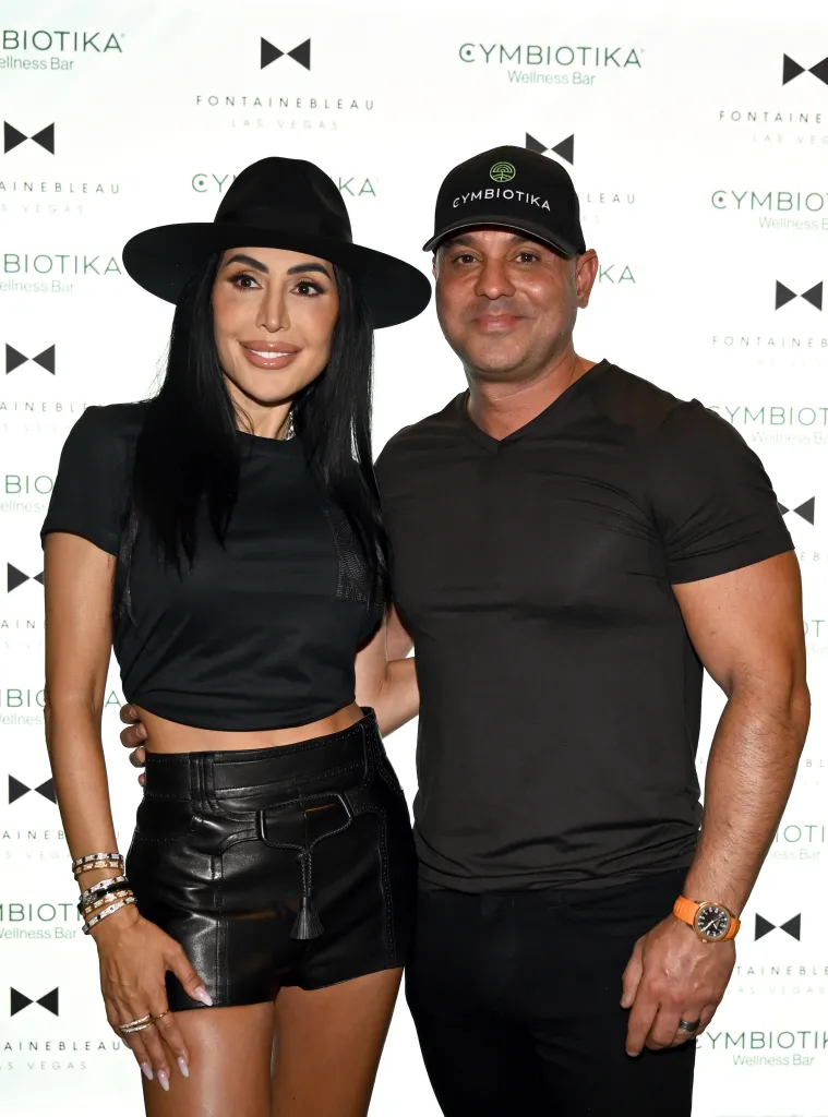 Durana Elmi and Shahab Elmi, Co-Founders of Cymbiotika, pose together at the grand opening of the Cymbiotika Wellness Bar.