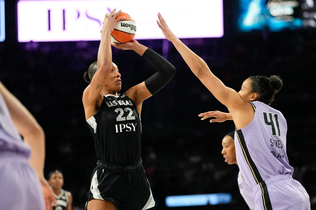 Las Vegas Aces center A'ja Wilson (22) shoots the ball against Golden State Valkyries center Kiah Stokes (41).