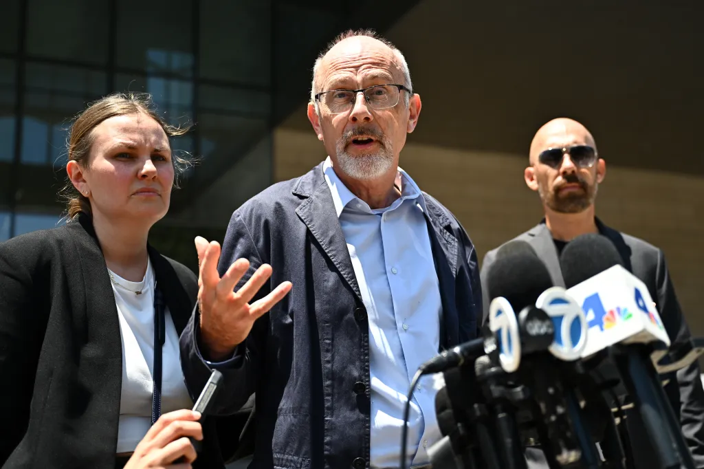 From left, Leah, Joel and Joel Rinderknecht, family of Jonathan Rinderknecht, speaks outside federal court after a federal judge declared a mistrial in the arson case against Rinderknecht, who is accused of sparking the deadly 2025 Palisades Fire, on Friday, June 26, 2026, in Los Angeles.